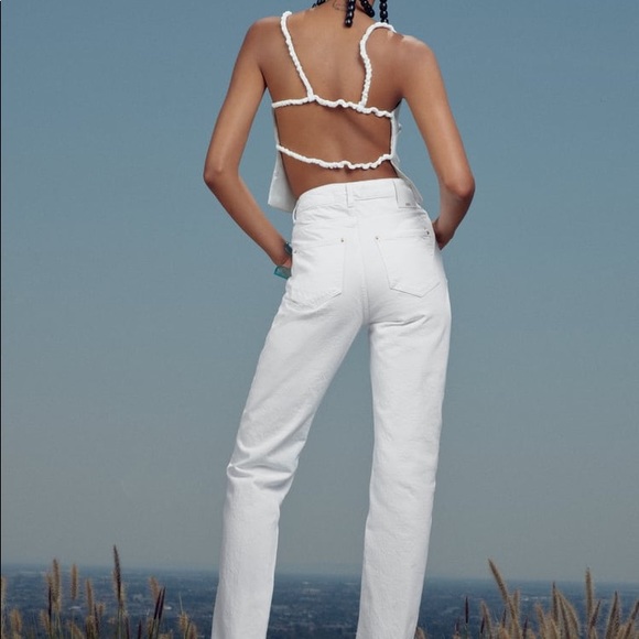 High-waisted jeans with five pockets and straight legs. Washed effect. - Picture 10 of 14